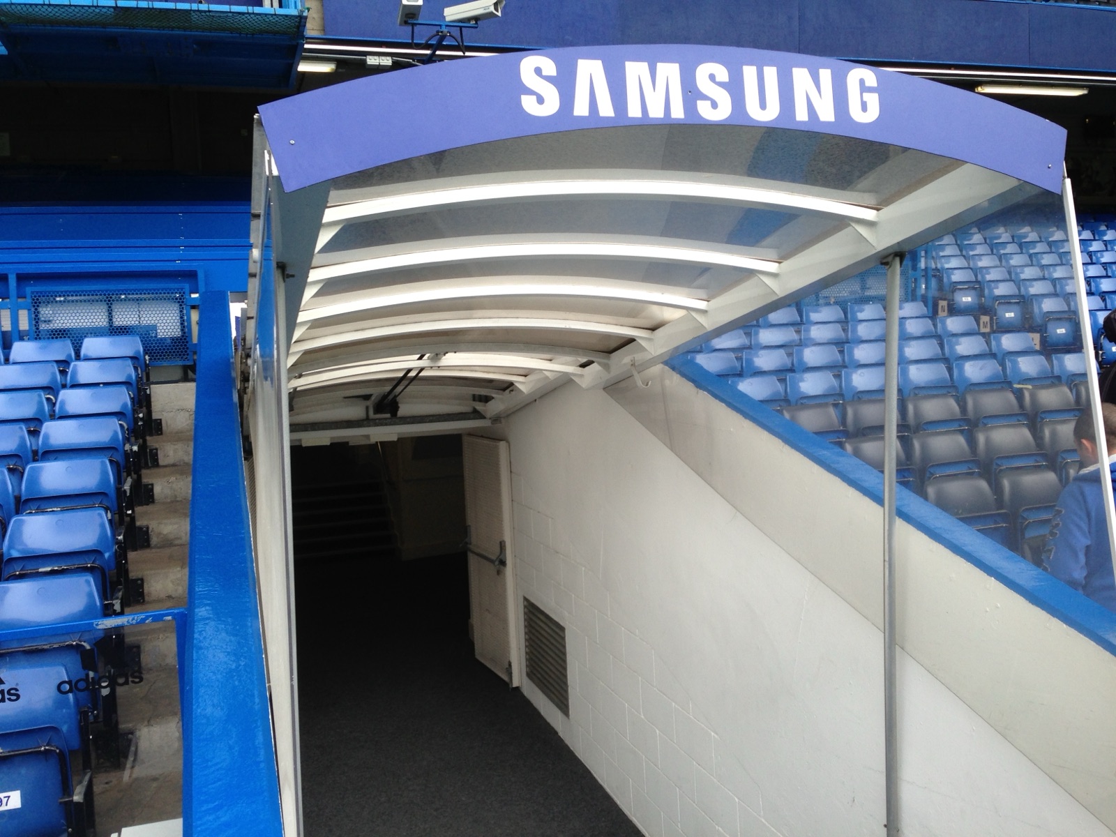The players' tunnel and blue seats at Stamford Bridge